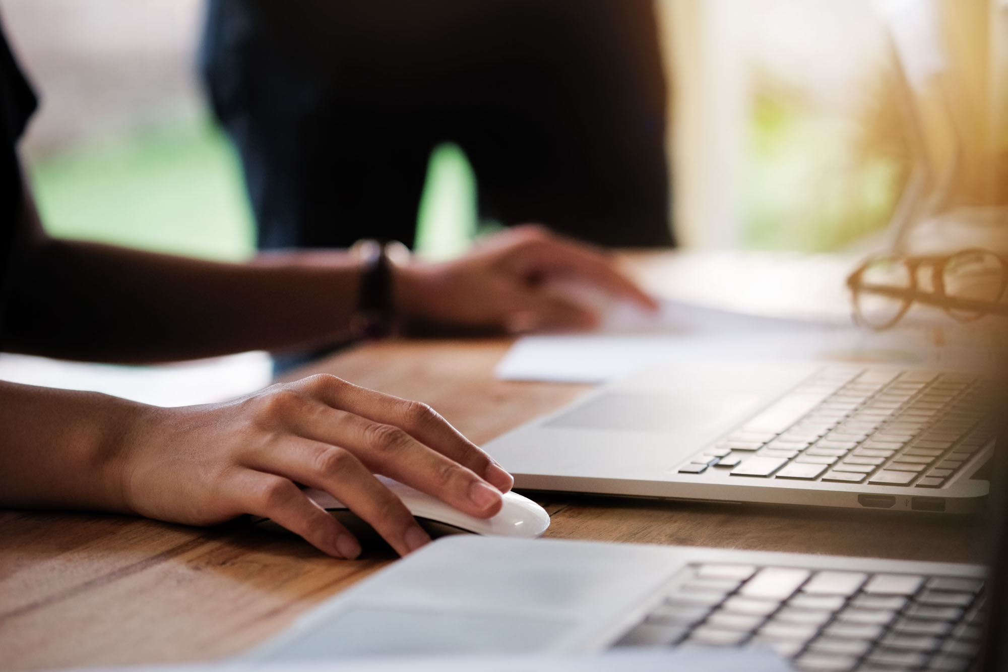 Close up on person using laptop computer