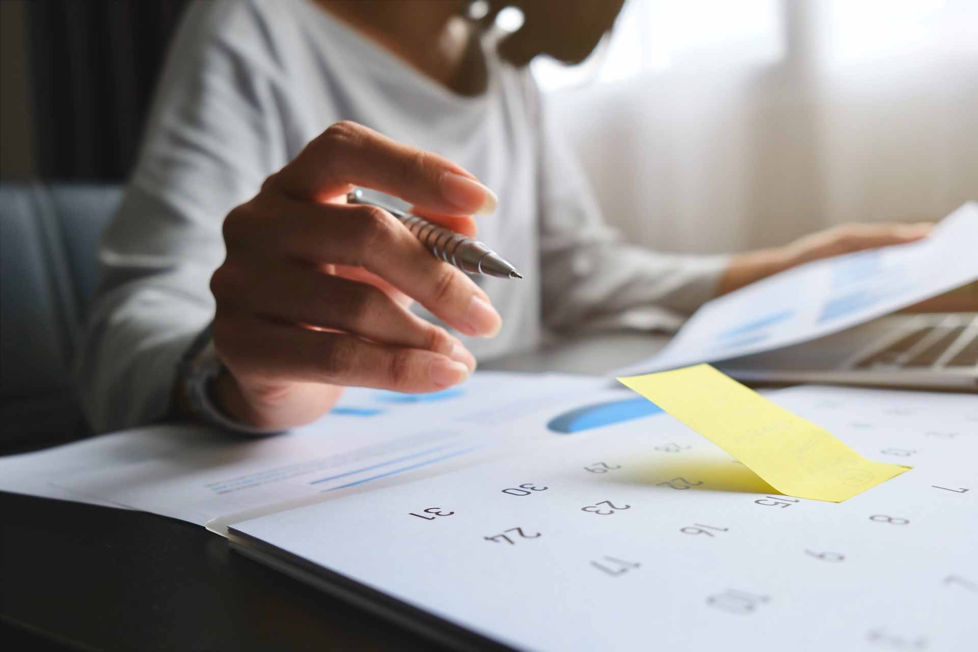 Low angle shot of busy woman working at desk